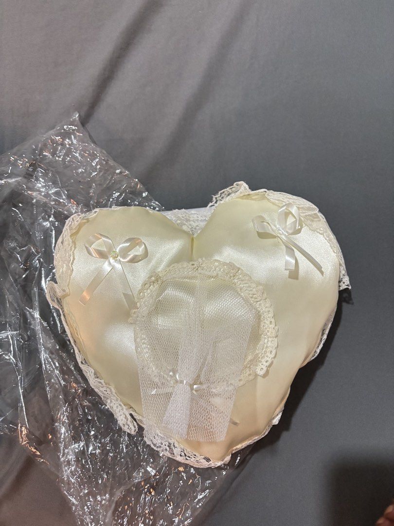 Heart Shaped Ring Pillow with Free Veil (Category: Rings) located in Paranaque City. Submitted by bestbunnyhop (Listing ID 1441409290, Image 2). Description: UNUSED - Creamy white satin heart-shaped pillow - Perfect for holding wedding rings - Decorated with elegant lace trim - Free: secondary veil Sold as a set Unused, no flaws Rfs: extra/unused. Decluttering. .