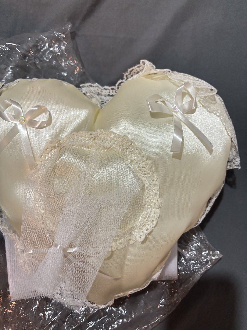Heart Shaped Ring Pillow with Free Veil (Category: Rings) located in Paranaque City. Submitted by bestbunnyhop (Listing ID 1441409290, Image 1). Description: UNUSED - Creamy white satin heart-shaped pillow - Perfect for holding wedding rings - Decorated with elegant lace trim - Free: secondary veil Sold as a set Unused, no flaws Rfs: extra/unused. Decluttering. .