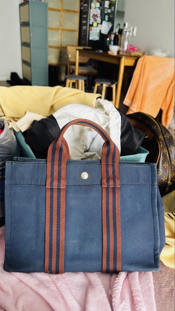 Hermes Herbag Canvas Tote Bag (Category: Luxury Bags & Wallets) located in Pasig City. Submitted by cecilececile4361 (Listing ID 1441438703, Image 1). Description: - Classic Hermes tote bag - Durable canvas material - Iconic double stripe design - Hardware shows some signs of wear - Spacious interior - Ideal for everyday use Hermès Fourre-Tout MM Tote Bag Purchased in Japan Canvas material Pre-owned with normal signs of use Spacious and lightweig