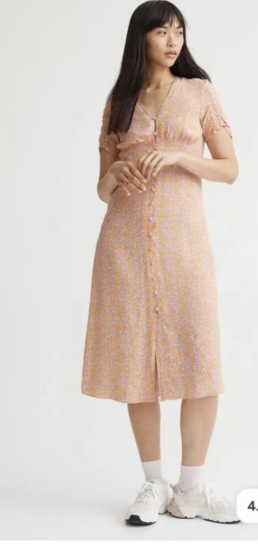 H&M Floral Print Button-Front Midi Dress (Category: Dresses) located in San Jose. Submitted by cheapest_thrill_closet (Listing ID 1441414039, Image 2). Description: - Cute H&M midi dress - All-over floral print (orange & pink) - Short sleeves with slight puff - Button-front detail - Midi length with a slit - Versatile: pairs well with sneakers or sandals.