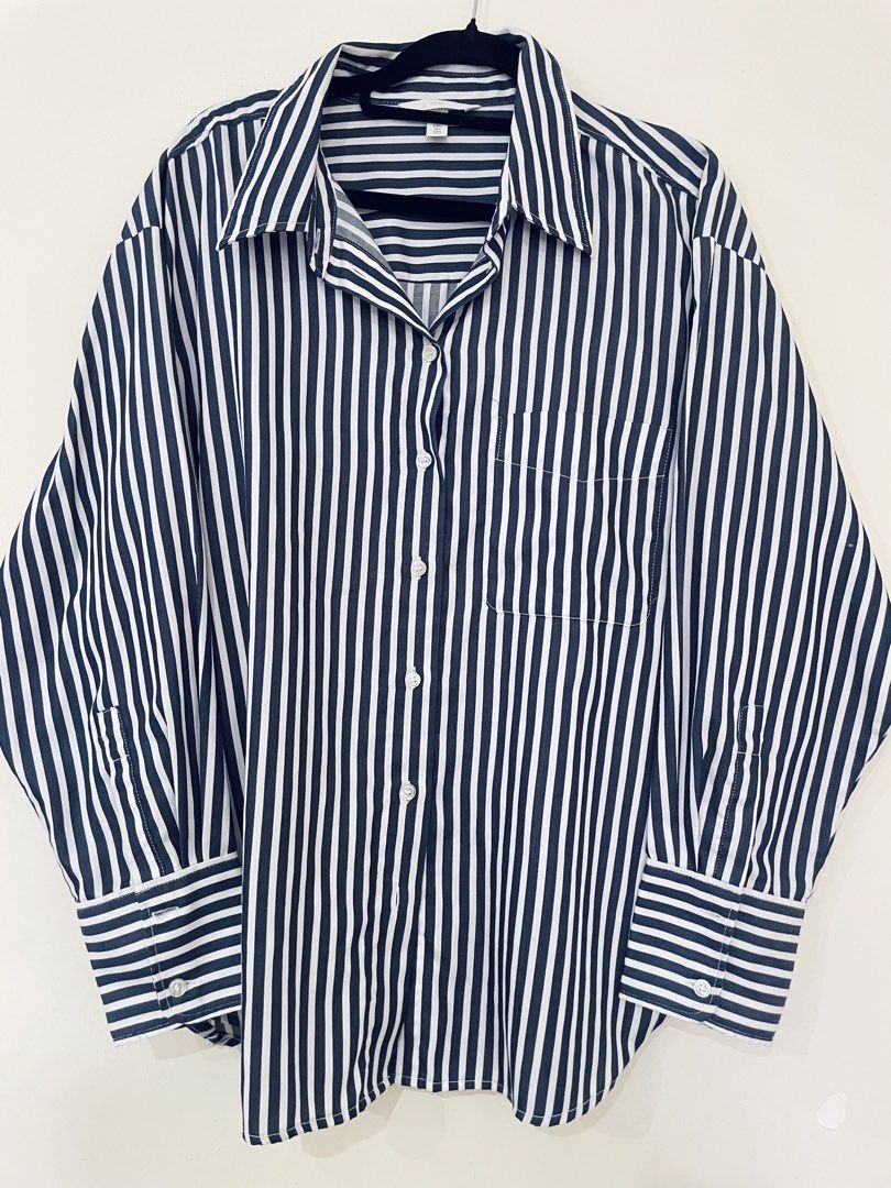 H&M Striped Oversized Button-Up Shirt (Category: Shirts) located in Mandaue City. Submitted by piacatrina08 (Listing ID 1441480958, Image 1). Description: - Fits L-XL - Navy blue & white stripes.