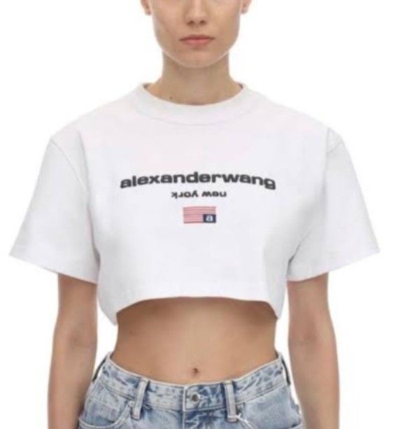 ALEXANDER WANG Cropped Tees ASPACK (Category: Luxury Apparel) located in Navotas City. Submitted by ms.soulana (Listing ID 1441462879, Image 3). Description: PreOwned LikeNew Authentic Alexander Wang cropped t-shirt Aspack Black & White - Features iconic brand name and New York graphic - Short sleeves and a comfortable boxy fit - Versatile styling: pairs perfectly with high-waisted jeans or skirts - A timeless addition to your casual wardrobe Sma