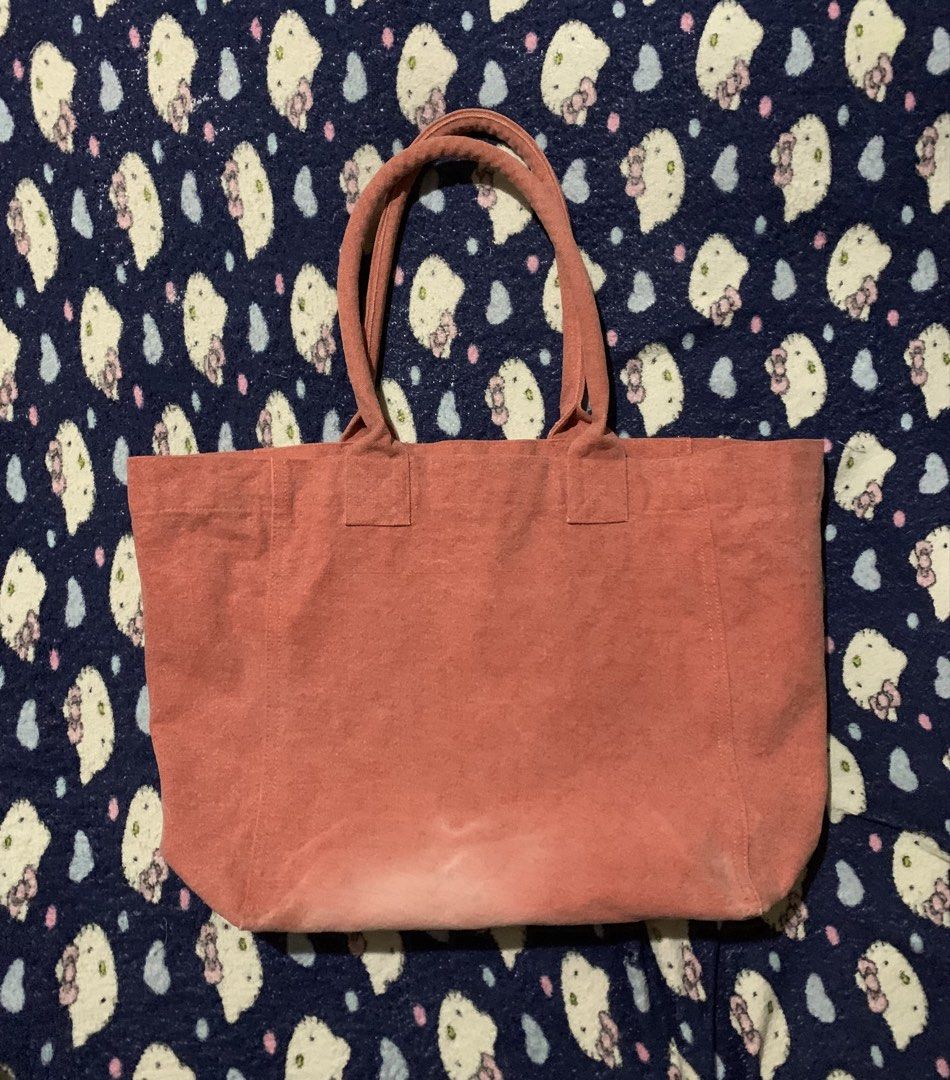 Isabel Marant Pink Canvas Tote Bag (Category: Tote Bags) located in Cebu City. Submitted by jkeive (Listing ID 1441498771, Image 2). Description: - Authentic pink Isabel Marant canvas tote bag - Features the signature Isabel Marant logo on the front - Spacious interior, ideal for everyday essentials - Durable and sturdy handles -Issue See last photo.