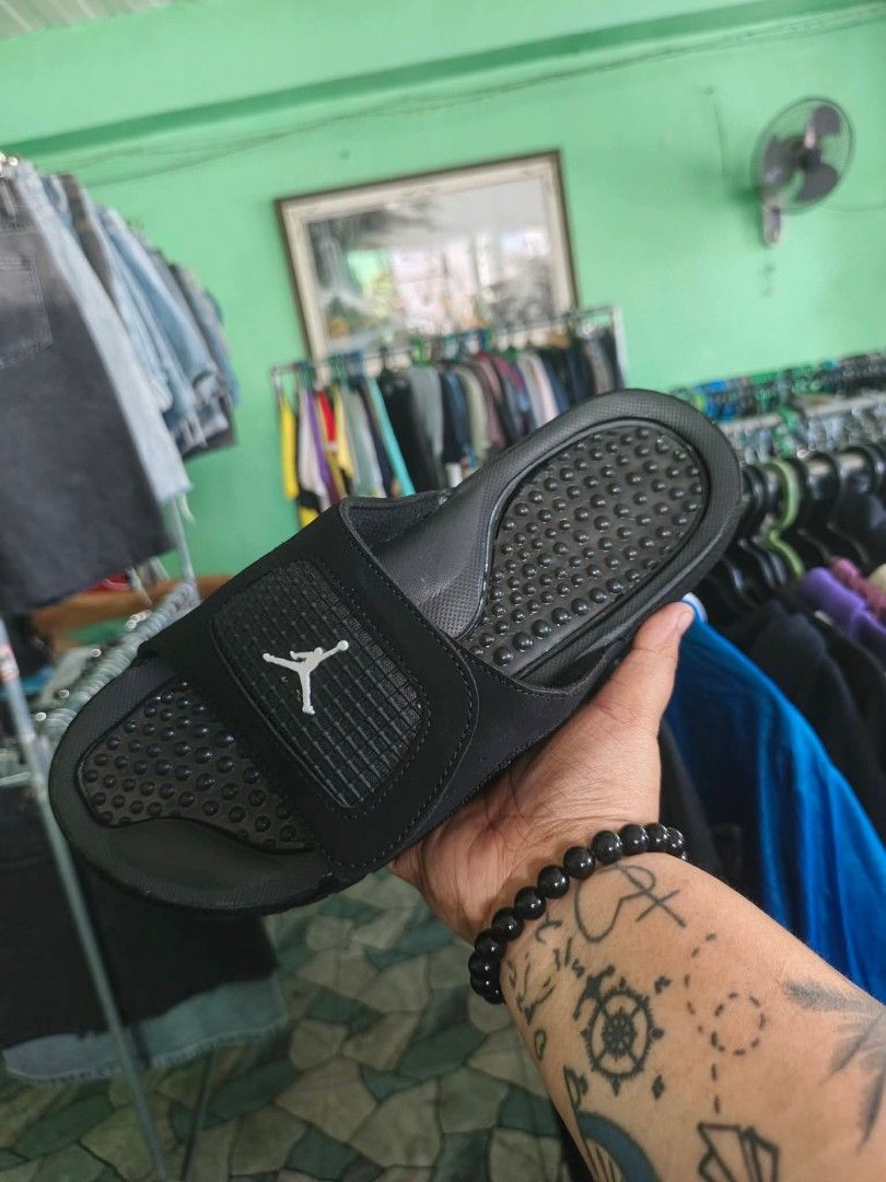 Jordan Slides - White/Black & Black/Red (Category: Slippers & Slides) located in Bacoor. Submitted by davealvare39194 (Listing ID 1441441710, Image 2). Description: - Two pairs of Jordan slides available: White/Black/Red and Black/Red. - Features the iconic Jordan Jumpman logo on both pairs. - Designed for ultimate comfort, perfect for everyday wear. - Ideal for lounging at home or running quick errands. - Adds a sporty touch to any casual outfit