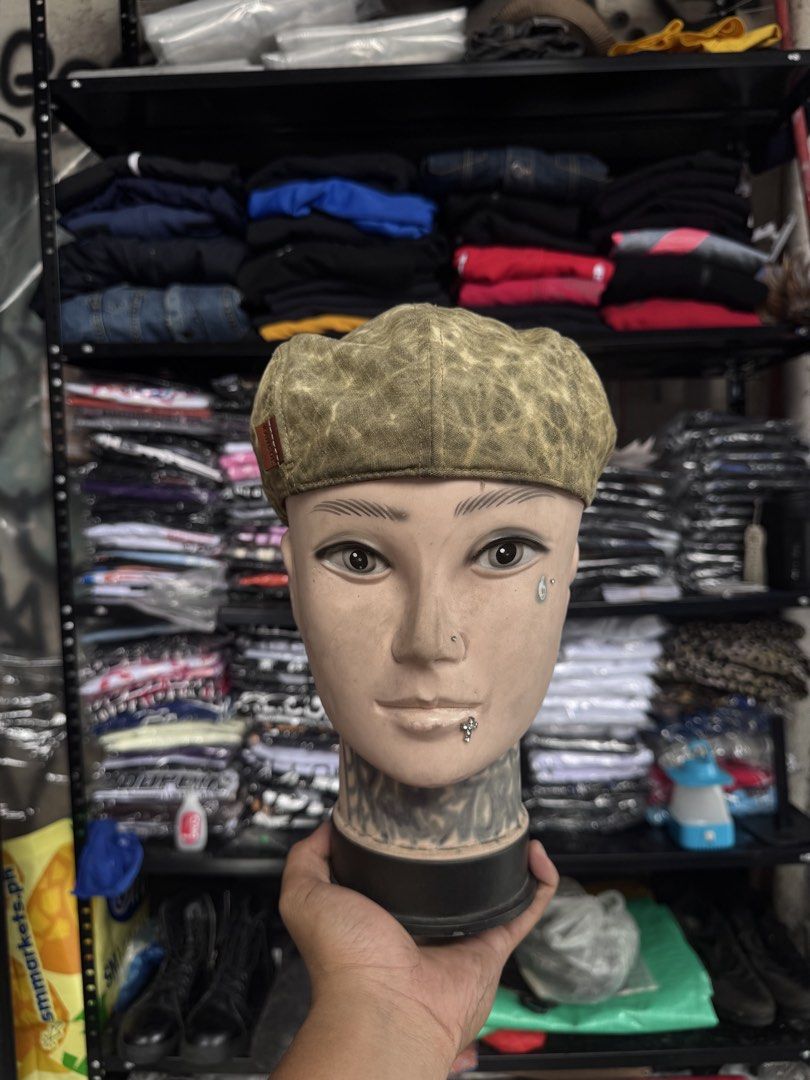 Kangol Flat Cap Hat Olive Green Patterned (Category: Caps & Hats) located in Pasig City. Submitted by dripthrift1600 (Listing ID 1441449324, Image 2). Description: - Olive green Kangol flat cap - Features a cool all-over patterned texture - Leather tab on the side with Kangol logo - Adds a stylish touch to any outfit - Looks great from all angles.