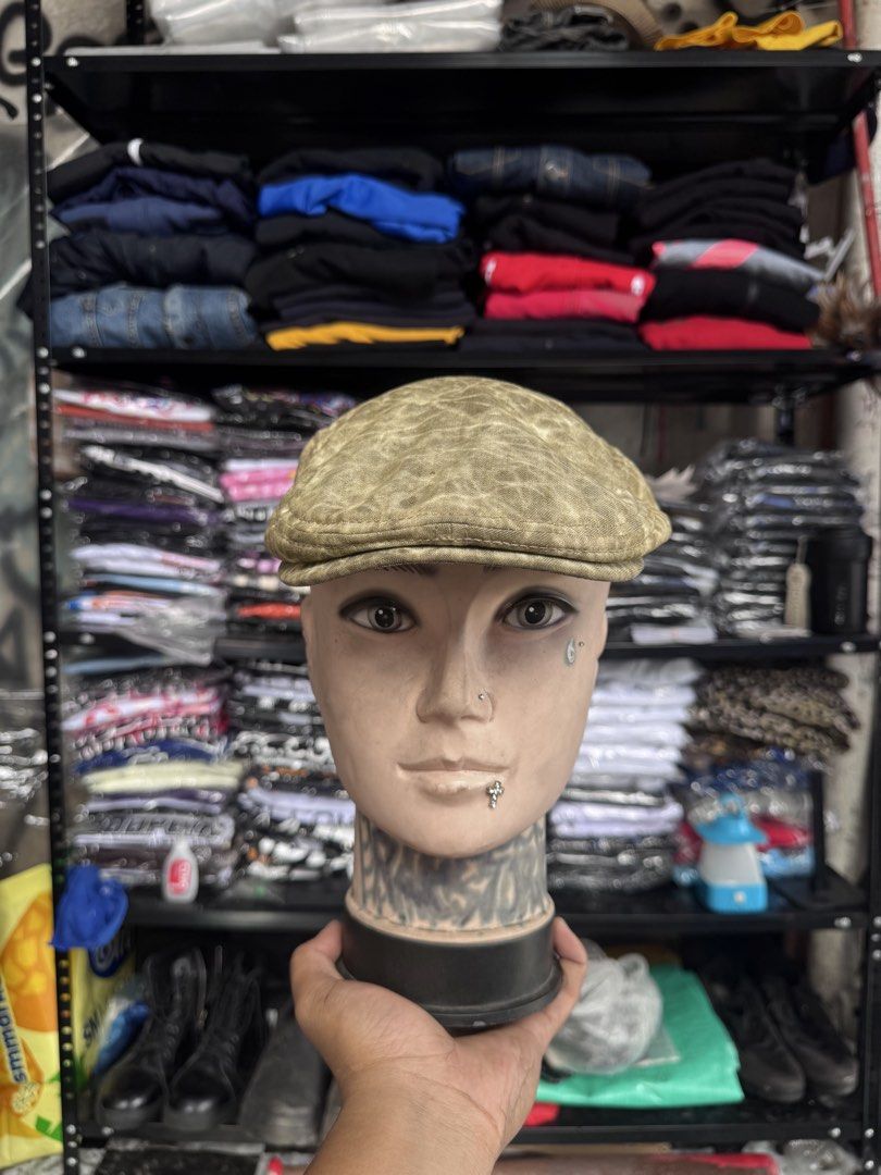 Kangol Flat Cap Hat Olive Green Patterned (Category: Caps & Hats) located in Pasig City. Submitted by dripthrift1600 (Listing ID 1441449324, Image 1). Description: - Olive green Kangol flat cap - Features a cool all-over patterned texture - Leather tab on the side with Kangol logo - Adds a stylish touch to any outfit - Looks great from all angles.