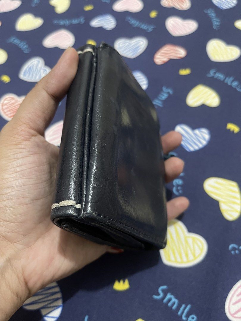 Kitamura Leather Bifold Wallet (Category: Wallets & Card holders) located in Quezon City. Submitted by minekoh21 (Listing ID 1441526386, Image 2). Description: - Brand: Kitamura - Material: Navy Blue Genuine Leather - Style: Bi-fold wallet - Features: Embroidered 'K' logo on front, interior card slots, coin pouch - Closure: Snap button - With Bills Compartment - With Card compartments - Small Size and very handy RFS: Too many wallets.