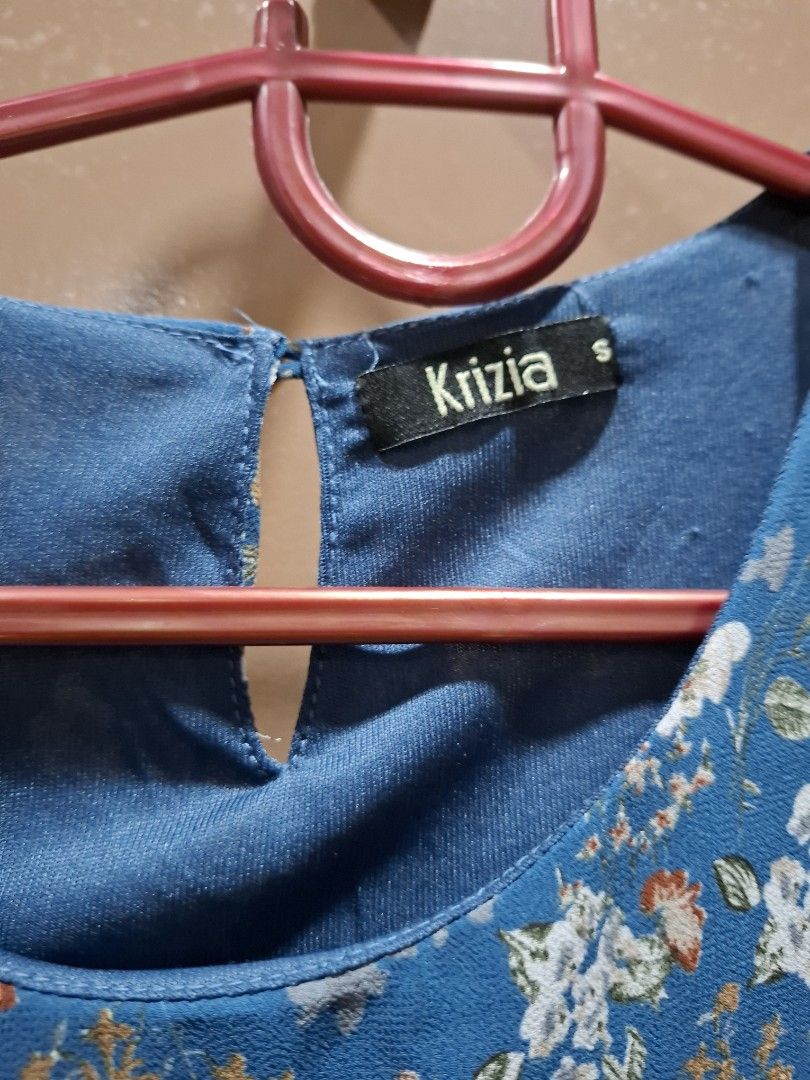 Krizia Blue Floral Ruffle Top Size S (Category: Blouses) located in San Juan City. Submitted by xiobe (Listing ID 1441397220, Image 2). Description: - Pretty blue top with white and orange floral print - Features charming ruffle details on the front - Estimated size: Small (S) - Versatile for casual outings or dressing up.