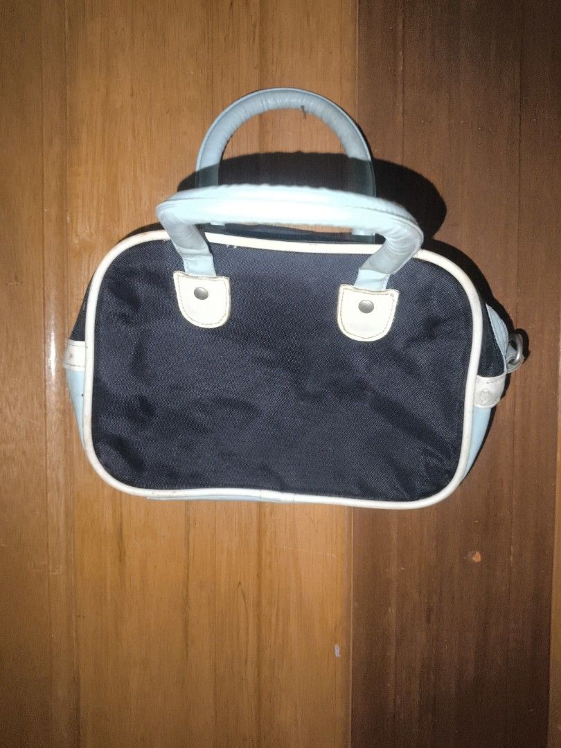 Lee Cooper Black and White Handbag (Category: Luxury Bags & Wallets) located in Calauan. Submitted by joshway (Listing ID 1441482440, Image 3). Description: - Cute Lee Cooper handbag - Color: Black with white and light blue accents - Features Lee Cooper logo on the front - Top handles for carrying - Zipper closure - Ideal for everyday use see pictures for issue.
