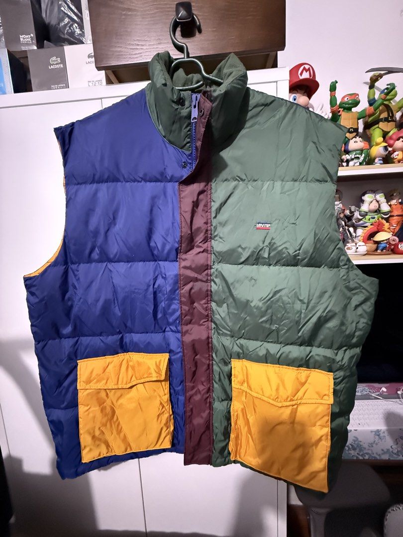 Levi's Oversized Colorblock Puffer Vest (Category: Vests) located in Manila. Submitted by blank_espacio (Listing ID 1441549080, Image 2). Description: - Cool colorblock Levi's puffer vest - Colorblock design: blue, green, and maroon panels - Two yellow flap pockets on the front - Zipper closure - Ideal for layering.