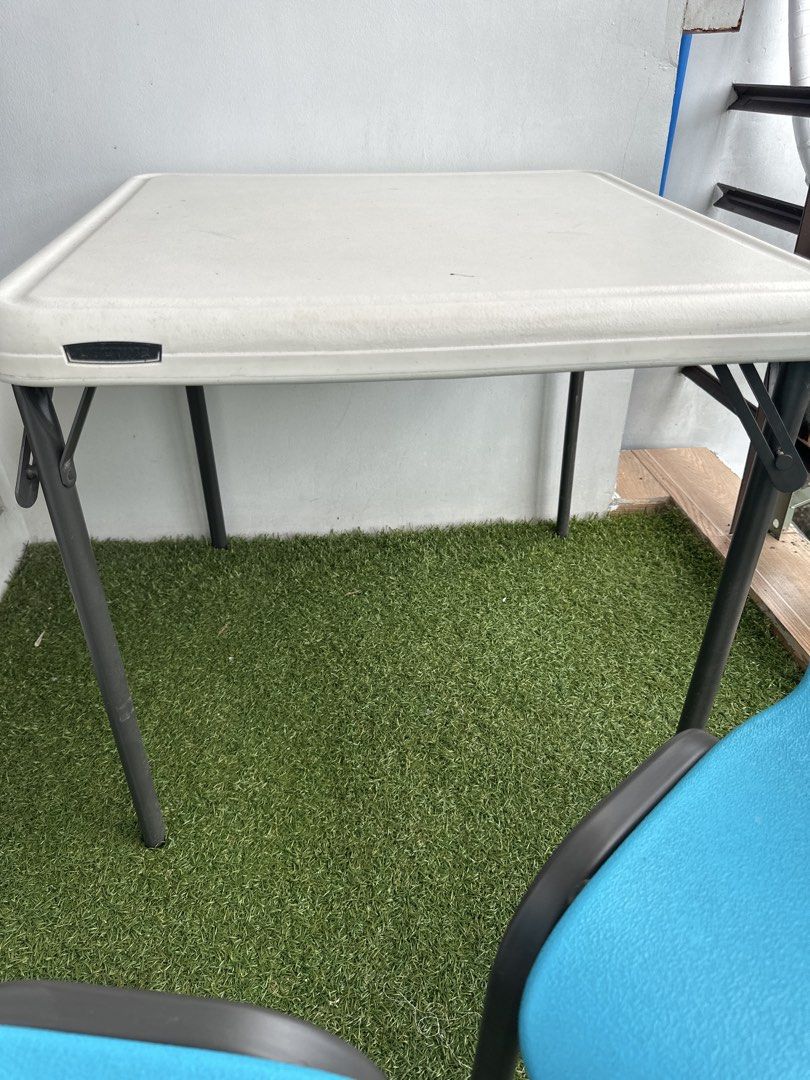 Lifetime Kids Table and Chairs AS SET (Category: Tables & Sets) located in Manila. Submitted by classywardrobemanila (Listing ID 1437471954, Image 3). Description: Sold as SET! RFS: Outgrown by the kids Negotiable - Lifetime square table with white surface and black folding legs - Includes two blue chairs - Chairs feature a hole in the backrest and black legs - Perfect for kids' play area or activities.