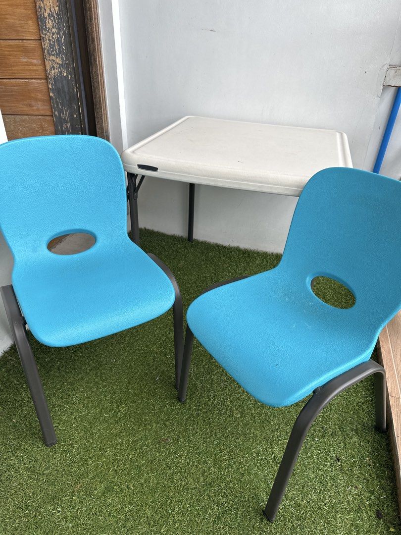 Lifetime Kids Table and Chairs AS SET (Category: Tables & Sets) located in Manila. Submitted by classywardrobemanila (Listing ID 1437471954, Image 1). Description: Sold as SET! RFS: Outgrown by the kids Negotiable - Lifetime square table with white surface and black folding legs - Includes two blue chairs - Chairs feature a hole in the backrest and black legs - Perfect for kids' play area or activities.