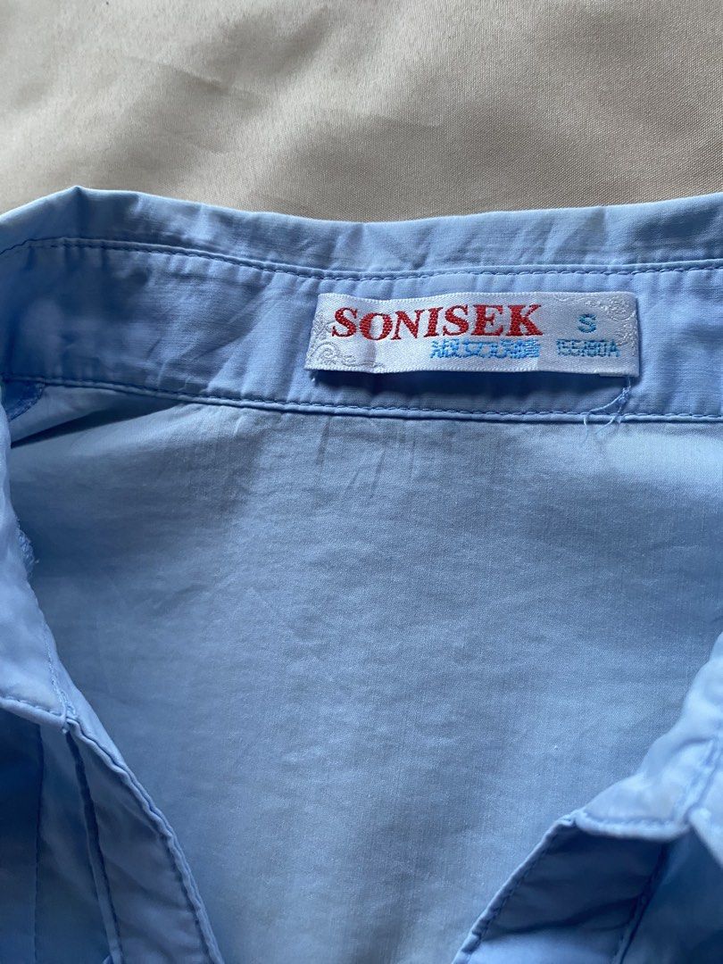 Light Blue Button-Up Short Sleeve Blouse Size S (Category: Blouses) located in Tarlac. Submitted by rieselects (Listing ID 1441463742, Image 2). Description: - Lost buttons - Minor marks on fabric (refer to last photo for details) - Versatile for casual outings or work attire.