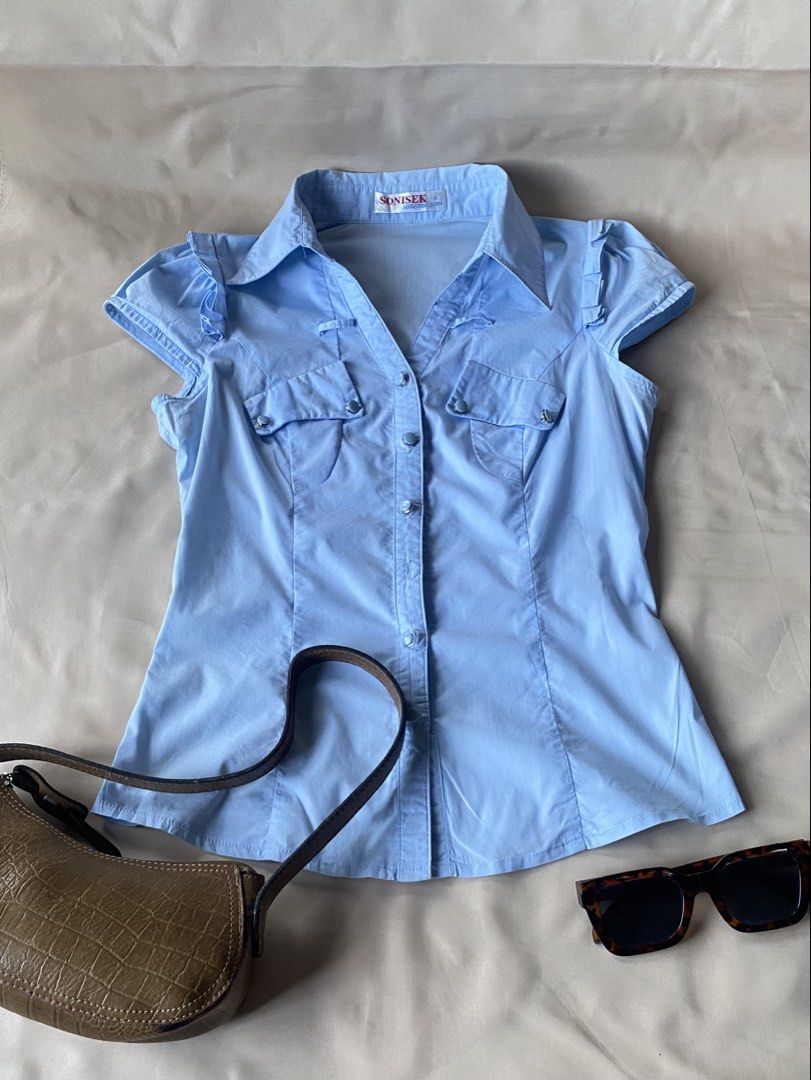 Light Blue Button-Up Short Sleeve Blouse Size S (Category: Blouses) located in Tarlac. Submitted by rieselects (Listing ID 1441463742, Image 1). Description: - Lost buttons - Minor marks on fabric (refer to last photo for details) - Versatile for casual outings or work attire.