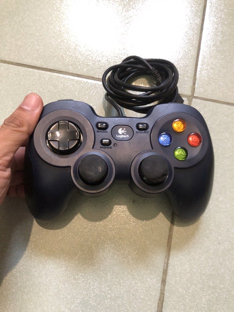 Logitec F310 wired usb gamepad (Category: Controllers) located in Quezon City. Submitted by markgolveo (Listing ID 1441477672, Image 1). Description: Logitec F310 wired usb gamepad Tested working Functional all switch and buttons analogs Wear on analog rubber.