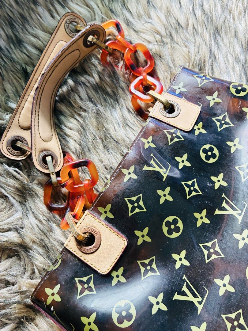 Louis Vuitton Monogram Ambre Vinyl Cabas MM (Category: Luxury Bags & Wallets) located in Makati City. Submitted by selltoshine (Listing ID 1441392100, Image 2). Description: - Authentic Louis Vuitton tote bag - Classic monogram on transparent vinyl - Tortoise shell chain detail - Leather straps - Patterned interior lining - Minor signs of wear on leather and hardware - Perfect statement piece.