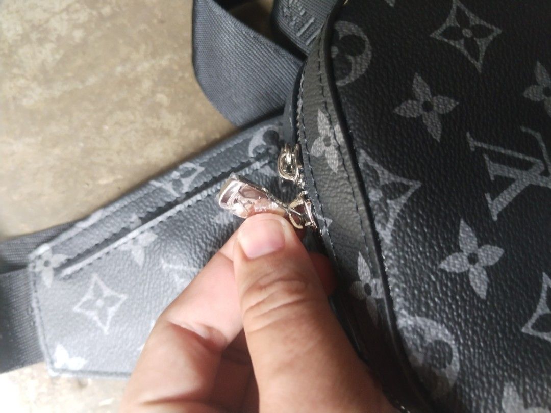 Louis Vuitton Monogram Eclipse Sling Bag (Category: Luxury Bags & Wallets) located in Alaminos. Submitted by osaj55756 (Listing ID 1441380276, Image 3). Description: Ukay source - Authentic Louis Vuitton sling bag - Monogram Eclipse canvas (black and grey) - Secure zipper closure - Adjustable strap for comfortable wear - Interior "Louis Vuitton Paris made in France" label - Ideal size for wallet and phone.