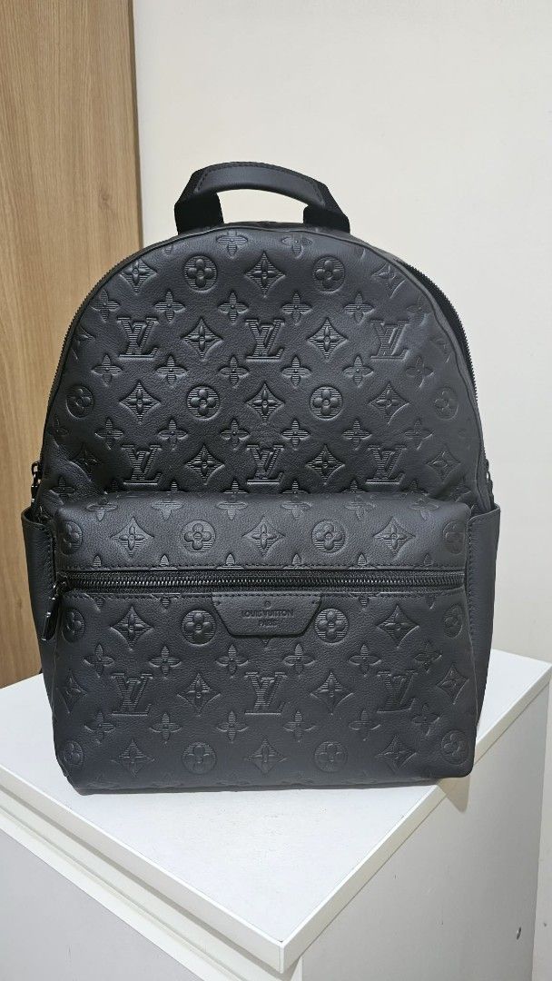 Louis Vuitton Monogram Embossed Black Leather Backpack (Category: Luxury Bags & Wallets) located in Caloocan City. Submitted by marie_0812 (Listing ID 1441436001, Image 1). Description: - All-over Monogram Embossed Pattern - Genuine Leather Material - Front Zip Pocket & Side Pockets - Adjustable Straps with LV Logo Detail - Spacious Interior - Ideal for Daily Use or Travel.