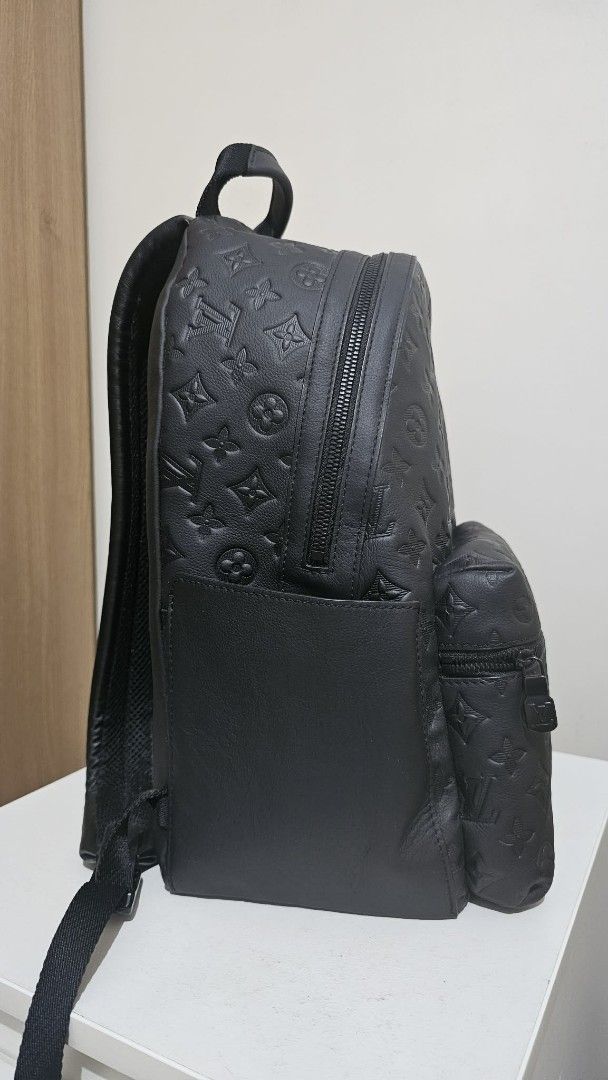 Louis Vuitton Monogram Embossed Black Leather Backpack (Category: Luxury Bags & Wallets) located in Caloocan City. Submitted by marie_0812 (Listing ID 1441436001, Image 3). Description: - All-over Monogram Embossed Pattern - Genuine Leather Material - Front Zip Pocket & Side Pockets - Adjustable Straps with LV Logo Detail - Spacious Interior - Ideal for Daily Use or Travel.