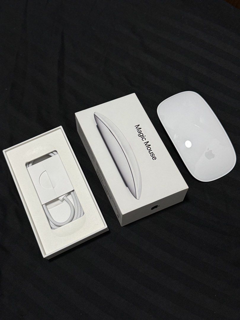 Magic Mouse - White (Model # A3204) (Category: Mouse & Mousepads) located in Manila. Submitted by itsmebrian1003 (Listing ID 1441380408, Image 1). Description: Brand New (Unsealed) Never been used. Complete Accessories, papers, etc. Freebie from the PowerMac Event. Reason for Selling: Not needed, much preferred the typical mouse..