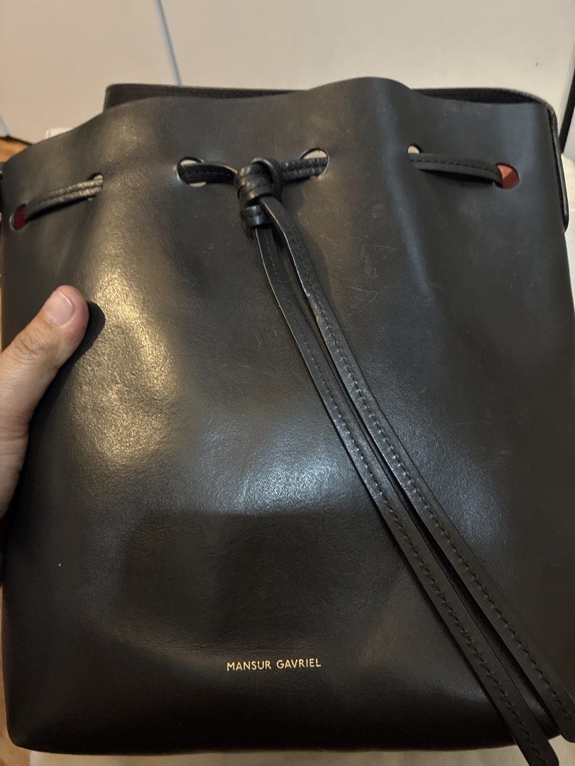 Mansur Gavriel Black Leather Bucket Bag (Category: Luxury Bags & Wallets) located in Rizal. Submitted by jclac.water (Listing ID 1441537057, Image 1). Description: - Classic black leather bucket bag - Brand: Mansur Gavriel - Closure: Drawstring - Handles: Leather - Style: Simple and chic, great for everyday use - Includes: Original dust bag.