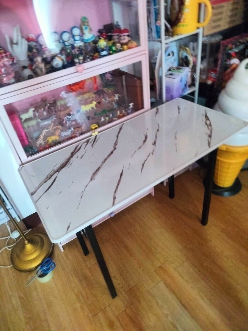 Marble Top Folding Table (Category: Tables & Sets) located in Bulacan. Submitted by nathariashoppe (Listing ID 1441413913, Image 2). Description: 50cm width 100cm length - Sturdy folding table - Marble-effect top - Black metal legs that fold flat - Ideal for extra dining space, study desk, or craft table - Compact and practical design - Ready for a new home.