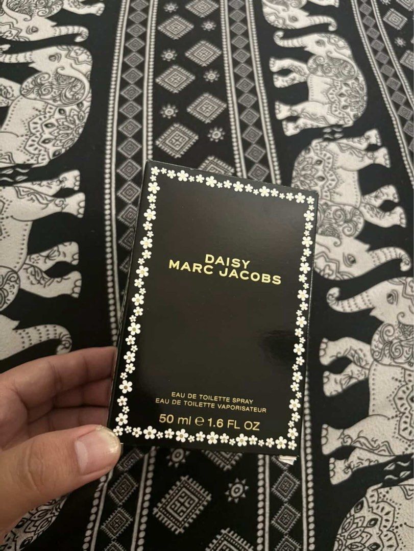 Marc Jacobs Daisy Eau de Toilette Spray 50ml (Category: Fragrance & Deodorants) located in Las Pinas. Submitted by declutterverse (Listing ID 1441510194, Image 2). Description: - Authentic Marc Jacobs Daisy Eau de Toilette - 50ml spray bottle (40-45ml left) - Includes original packaging - Features the iconic daisy cap - Ideal for everyday wear.