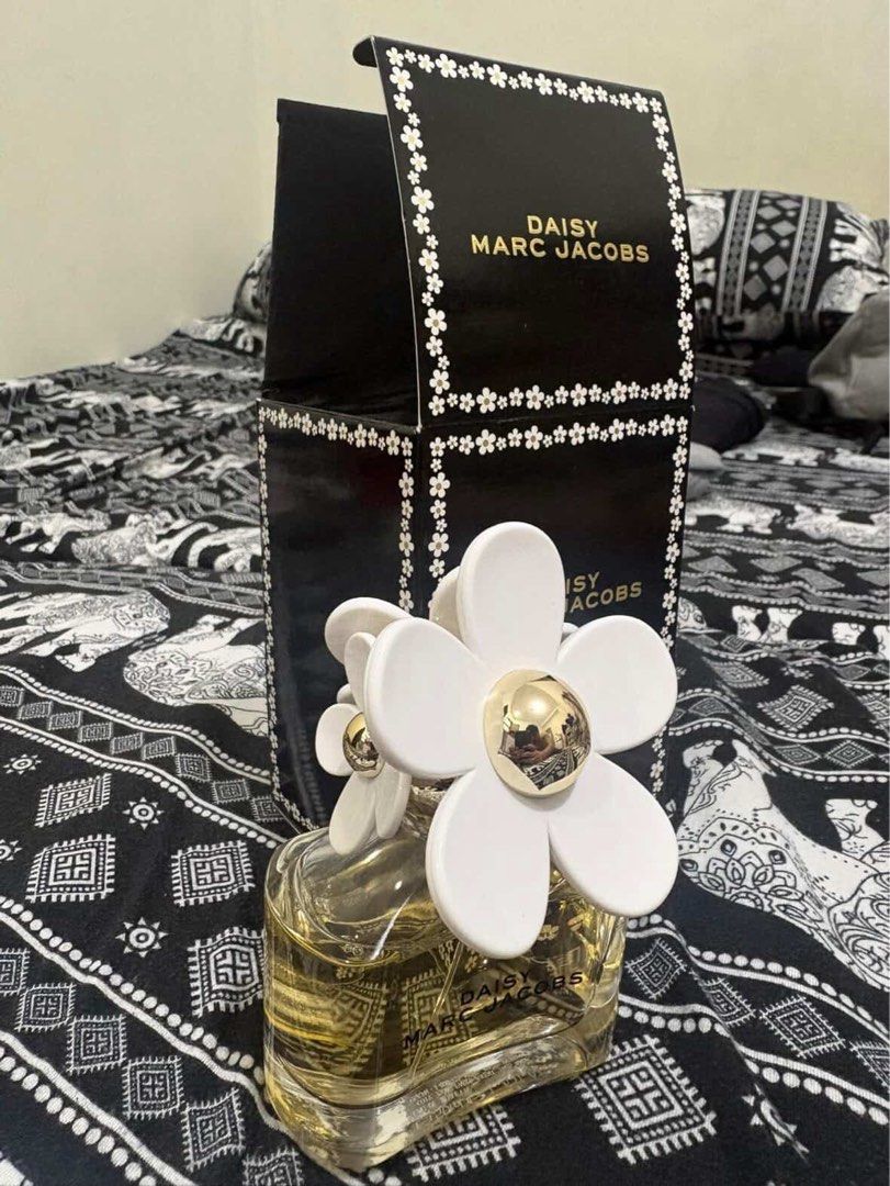 Marc Jacobs Daisy Eau de Toilette Spray 50ml (Category: Fragrance & Deodorants) located in Las Pinas. Submitted by declutterverse (Listing ID 1441510194, Image 3). Description: - Authentic Marc Jacobs Daisy Eau de Toilette - 50ml spray bottle (40-45ml left) - Includes original packaging - Features the iconic daisy cap - Ideal for everyday wear.