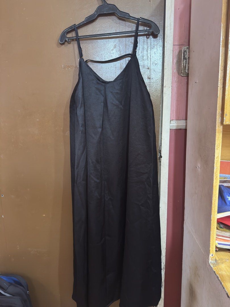 Maternity/Plus size Black Spaghetti Strap Midi Dress (Category: Dresses) located in Lucena. Submitted by miclara (Listing ID 1441421552, Image 2). Description: - Elegant black midi dress - Features delicate spaghetti straps - Unique criss-cross detail at the back - Fabric has a subtle, sophisticated sheen - Relaxed fit for comfortable wear - Versatile: great for layering or wearing solo.