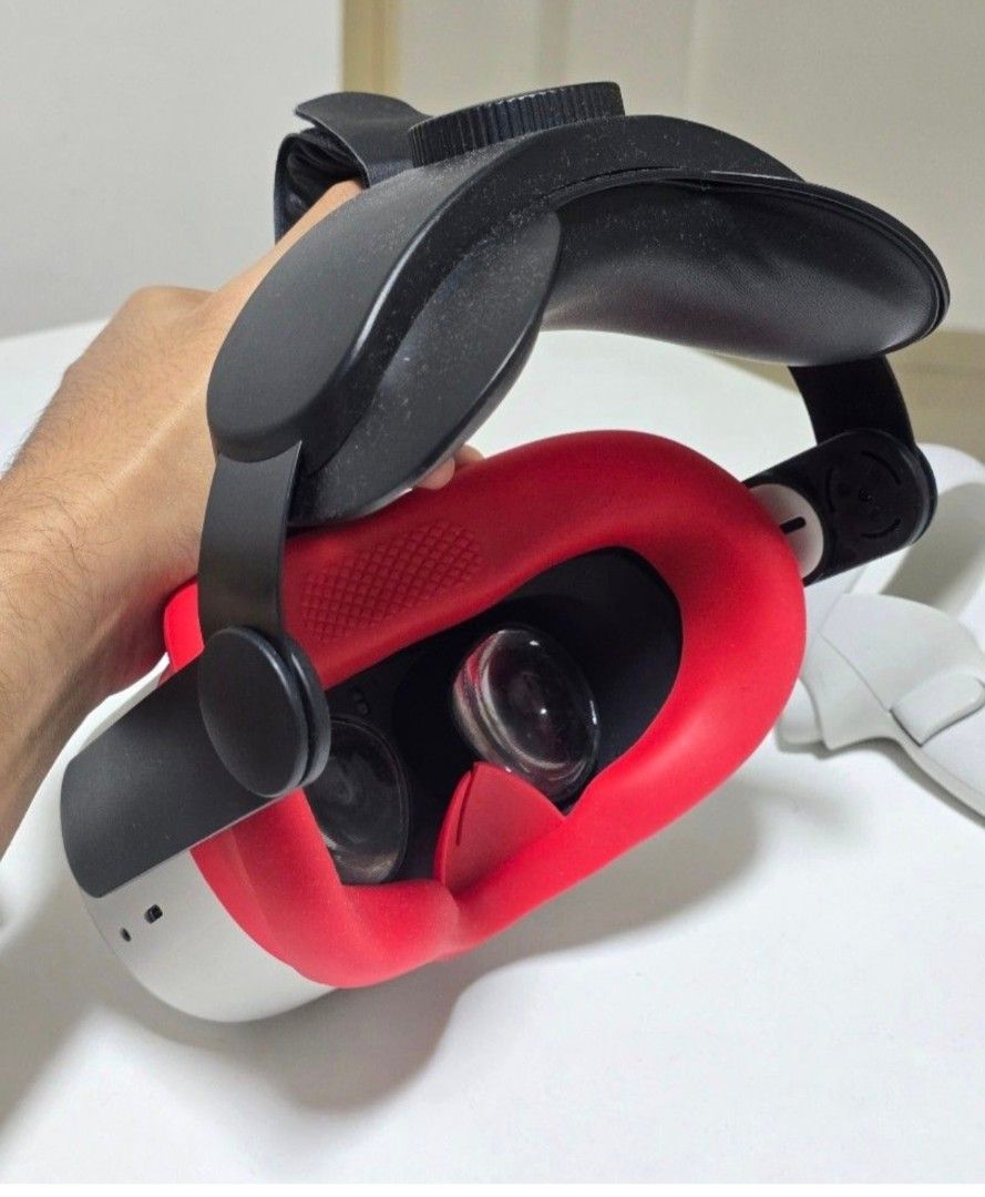 Meta Quest 2 VR Headset with Controllers (Category: Virtual Reality) located in Singapore. Submitted by zhelectronics (Listing ID 1441474102, Image 3). Description: - Meta Quest 2 VR Headset - Two Controllers - Carrying Case - Red Facial Interface (Added Bonus!) - Ideal for Gaming & Virtual Experiences - Ready for a New Owner.