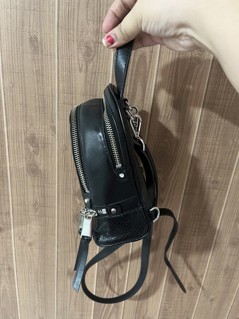 Michael Kors Mini Rhea Backpack Genuine Leather (Retail) (Category: Backpacks) located in Quezon City. Submitted by myyyfinds (Listing ID 1441396174, Image 3). Description: Genuine Leather with Snakeskin Design comes with 2 straps for backpack can be converted to crossbody (like LV PALM SPRINGS) Guaranteed authentic with cards and original satin dustbag. Bought from MK Retail Store (not outlet) VERY GOOD CONDITION, SILVER METALS VERY SHINY NO TO 