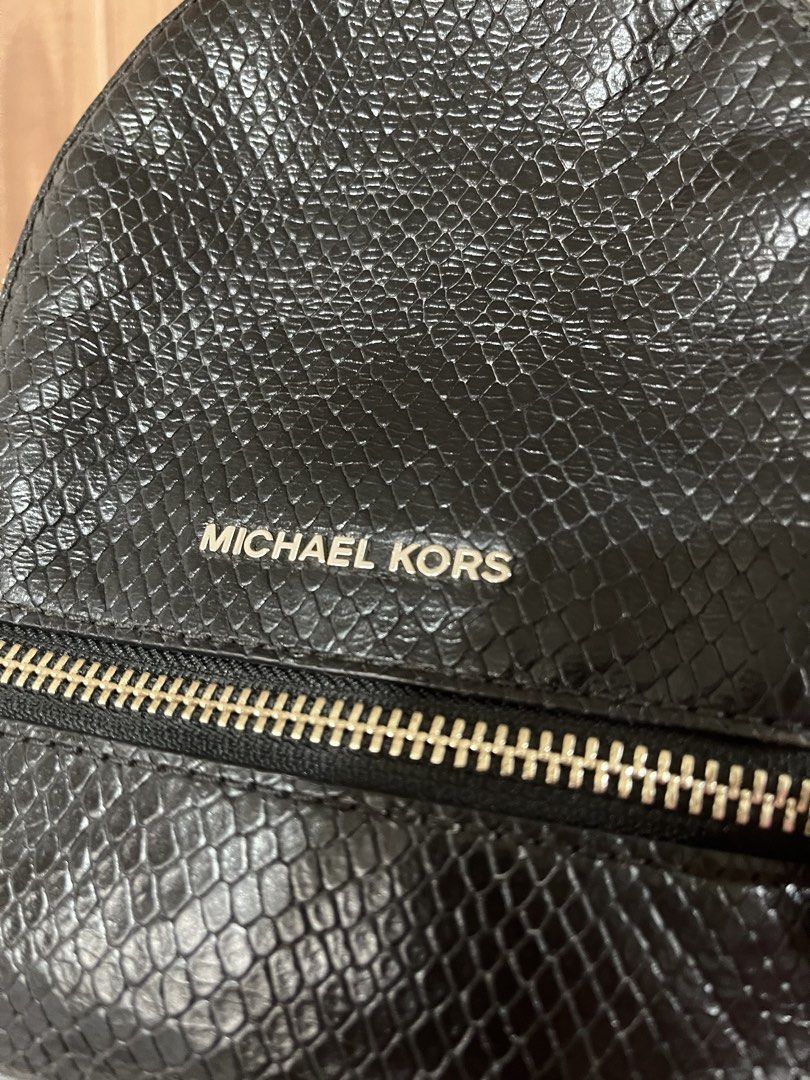 Michael Kors Mini Rhea Backpack Genuine Leather (Retail) (Category: Backpacks) located in Quezon City. Submitted by myyyfinds (Listing ID 1441396174, Image 2). Description: Genuine Leather with Snakeskin Design comes with 2 straps for backpack can be converted to crossbody (like LV PALM SPRINGS) Guaranteed authentic with cards and original satin dustbag. Bought from MK Retail Store (not outlet) VERY GOOD CONDITION, SILVER METALS VERY SHINY NO TO 