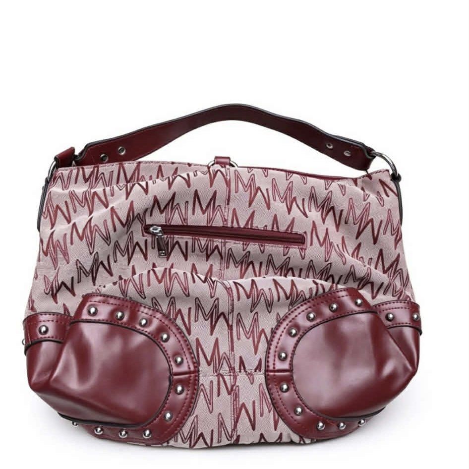 MICHAELA Signature Monogram Studded Hobo Shoulder Bag (Category: Shoulder Bags) located in Pasay City. Submitted by fromtheashes (Listing ID 1441472654, Image 1). Description: issue: leather peeling This is a medium-sized everyday hobo bag featuring MICHAELA’s signature repeating “M” monogram print in deep burgundy/maroon against a light neutral canvas base. It is accented with smooth vegan/faux leather trim on the handle, corners, and bottom, fi