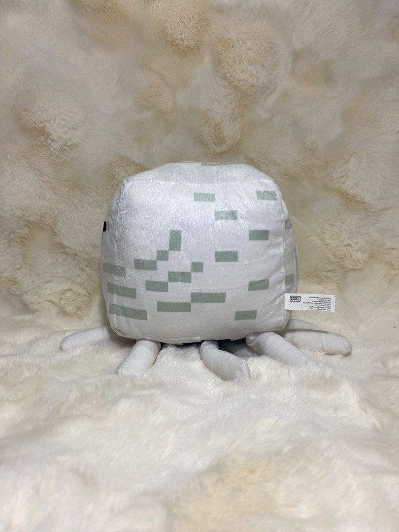 Minecraft Ghast Plush Toy (Category: Plushies & Soft Toys) located in Kalibo. Submitted by ollie_stuffshop (Listing ID 1441520782, Image 2). Description: 23cm x 16cm Before you send your inquiries: ❗️Last Price is already posted ❗️Manage your expectations, WYSIWYG ❗️May need washing ❗️Shipping day is every Sunday - Soft and cuddly Minecraft Ghast plush toy - White with grey pixelated details - Approximately 6 inches tall - Features official Minec