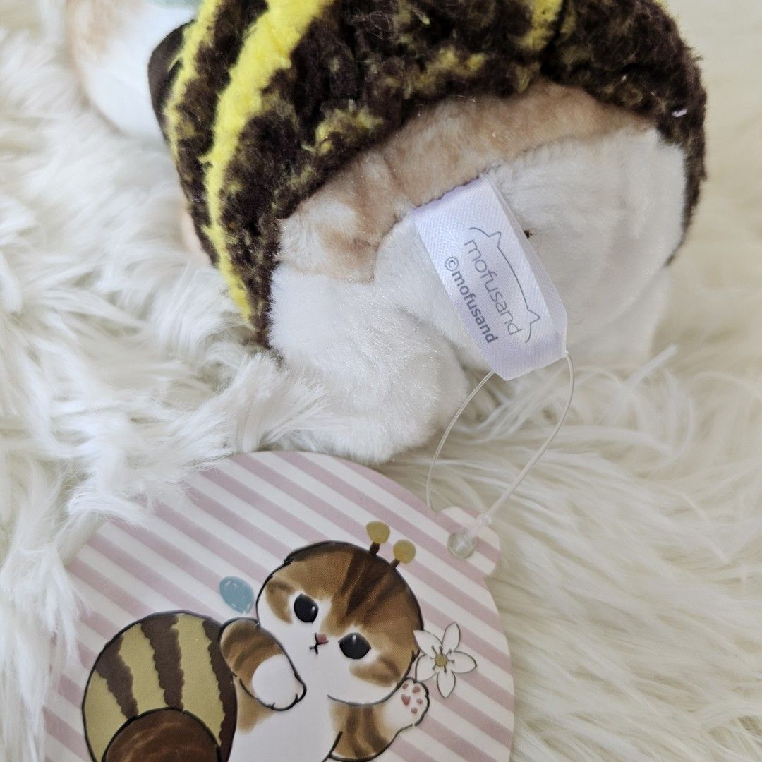 Mofusand Cat Bee Plush Toy with Tag (Category: Plushies & Soft Toys) located in Taguig. Submitted by ljdm_22 (Listing ID 1441514392, Image 3). Description: - Adorable Mofusand small plush toy - Features a cat dressed as a bee! - Comes with original tags attached - Ideal for collectors or as a gift - Perfect for display.