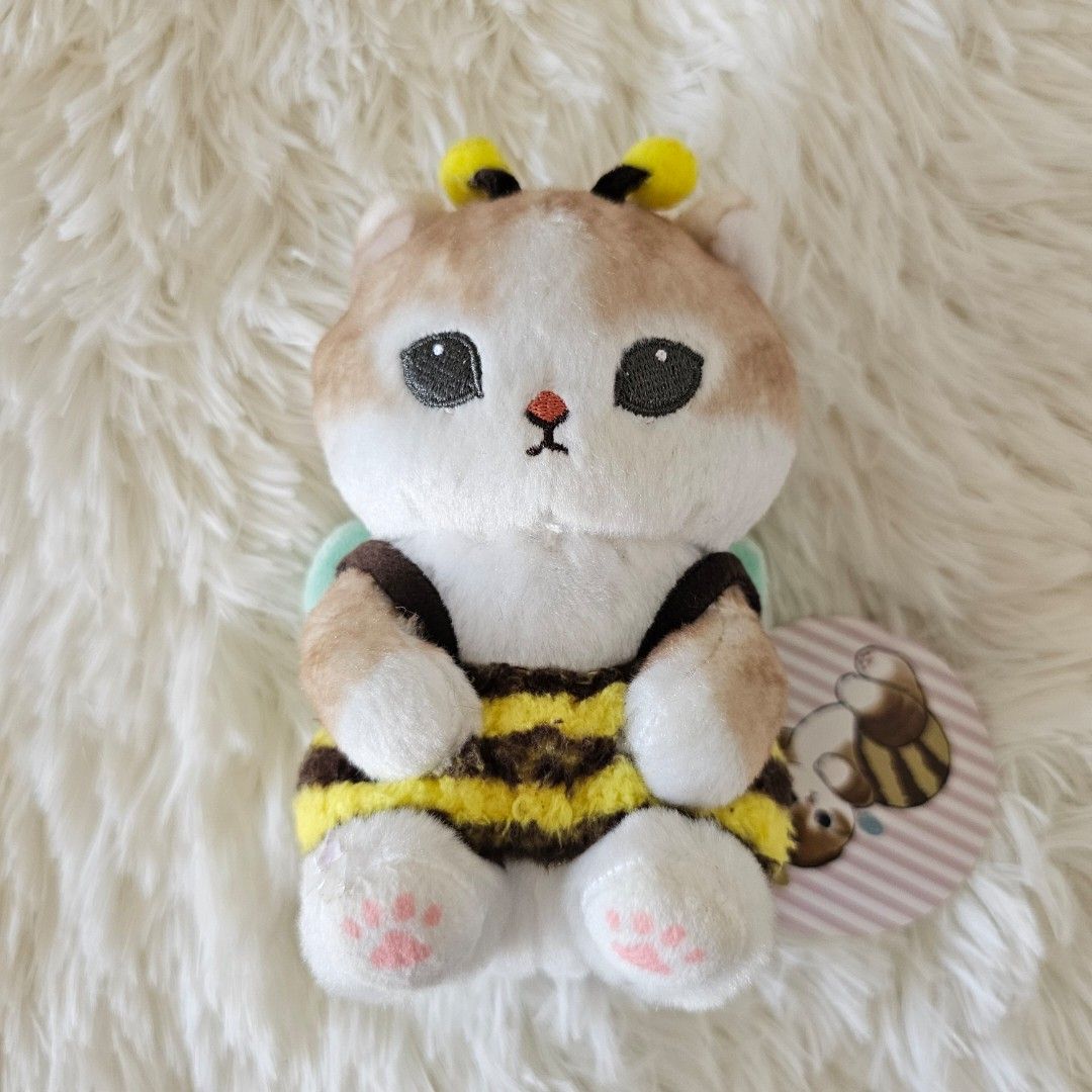 Mofusand Cat Bee Plush Toy with Tag (Category: Plushies & Soft Toys) located in Taguig. Submitted by ljdm_22 (Listing ID 1441514392, Image 1). Description: - Adorable Mofusand small plush toy - Features a cat dressed as a bee! - Comes with original tags attached - Ideal for collectors or as a gift - Perfect for display.