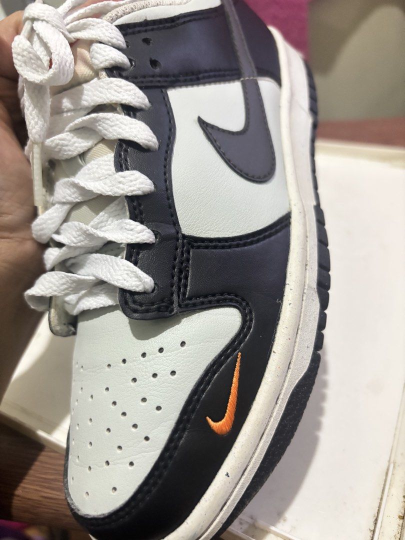 Nike Dunk Low Black White Orange Swoosh (Category: Sneakers) located in Quezon City. Submitted by kwiniemariecusi (Listing ID 1441431756, Image 3). Description: - Authentic Nike Dunk Low sneakers - Classic colorway: Black, White, and Orange - Iconic Nike Swoosh branding - Unique small orange swoosh detail on the toe box - Versatile for everyday style and wear.