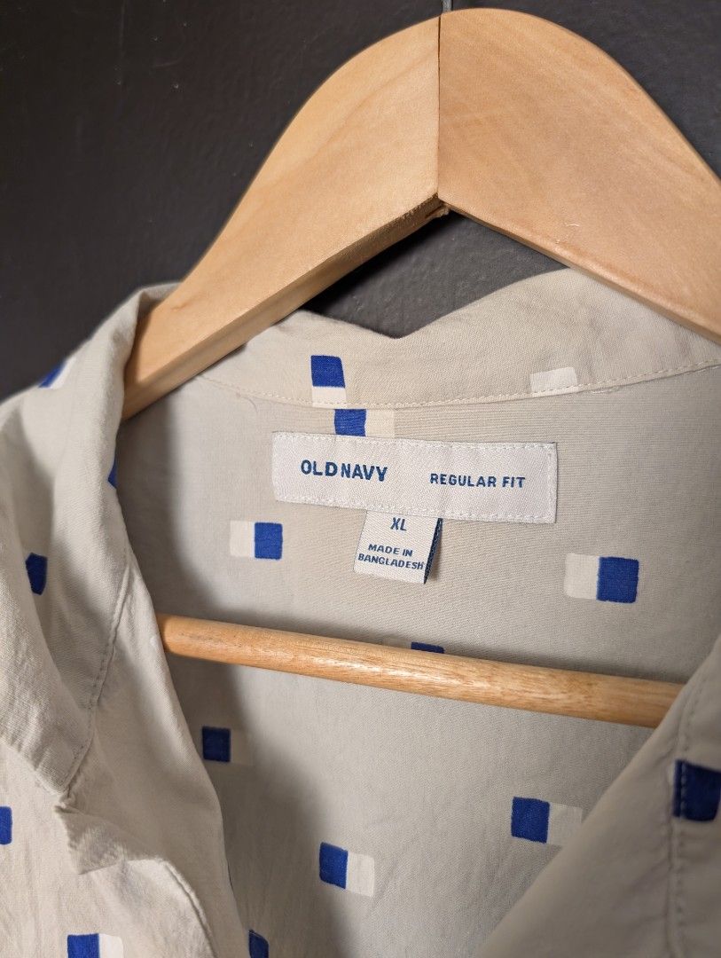 Old Navy Regular Fit Short Sleeve Button Up Shirt (Category: Tshirts & Polo Shirts ) located in Manila. Submitted by miloilmo (Listing ID 1441478755, Image 2). Description: - Old Navy Short Sleeve Shirt - Size: XL - Fit: Regular - Color: Beige - Pattern: Blue and White Geometric - Closure: Button-up front - Style: Casual wear - Used three times only.