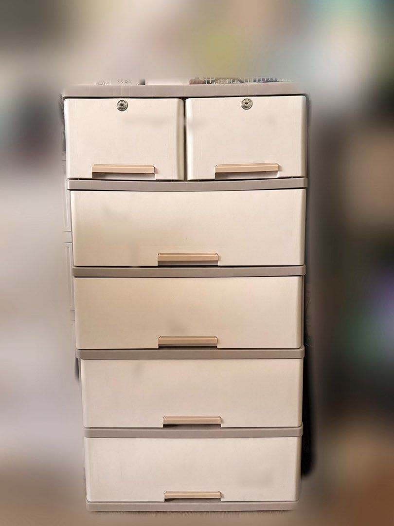 Plastic Storage Cabinet with 6 Drawers (Category: Shelves, Cabinets & Racks) located in Manila. Submitted by mango_applem (Listing ID 1441532570, Image 1). Description: - 6-drawer plastic storage cabinet - Light beige color with grey trim - Top two drawers feature locks for added security - Ideal for organizing clothes, toys, and various household items - Easy to assemble and portable.