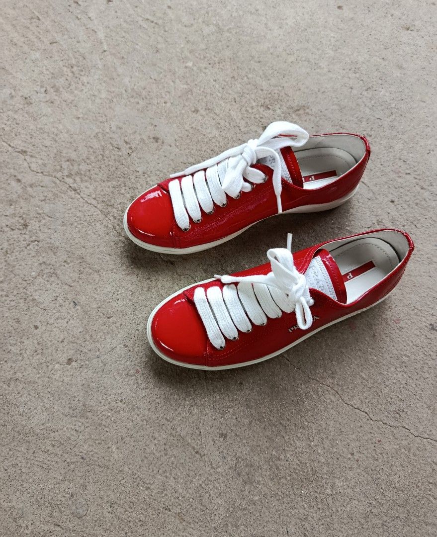 Prada - Red Patent Leather Upper White Lace (Category: Sneakers) located in San Fernando. Submitted by son.twice.stuff (Listing ID 1441429687, Image 3). Description: Item: Prada - Red Patent Leather Upper White Lace Tagged Size: 36 1/2 Dimensions Insole: 9 Inches / 23CM Outsole: 9.5 Inches / 24 CM Condition: 9/10 Made in Vietnam Price: 6800 Free Shipping.