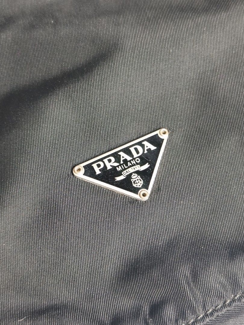 Prada Nylon Pouch (Category: Luxury Bags & Wallets) located in Bulacan. Submitted by 4kcollection (Listing ID 1441449137, Image 2). Description: Prada Nylon Pouch Pre-loved from Japan 🇯🇵 Very Good Condition Size: Small With Chain Needs Clean lining No Rubs No Pin Hole Dm for sure buyer 📩 MOP: Gcash / Maya / BPI Courier: J&t / Lbc / Lalamove Location: SJDM Bulacan.