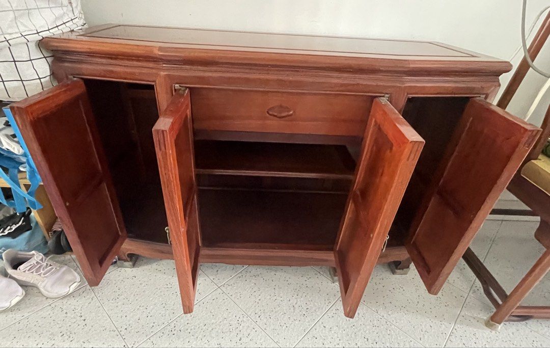 Rosewood cabinet & TV console (Category: TV Consoles) located in Singapore. Submitted by amuletuser (Listing ID 1441453154, Image 3). Description: Well maintained Rosewood tv console or cabinet. Measurement: 111 by 40.5 (middle width) by 78.5cm (height) Side width is 36cm No crack or loose joint. All hinges are functioning. No glass top. Please arrange your own transportation Thanks for viewing..