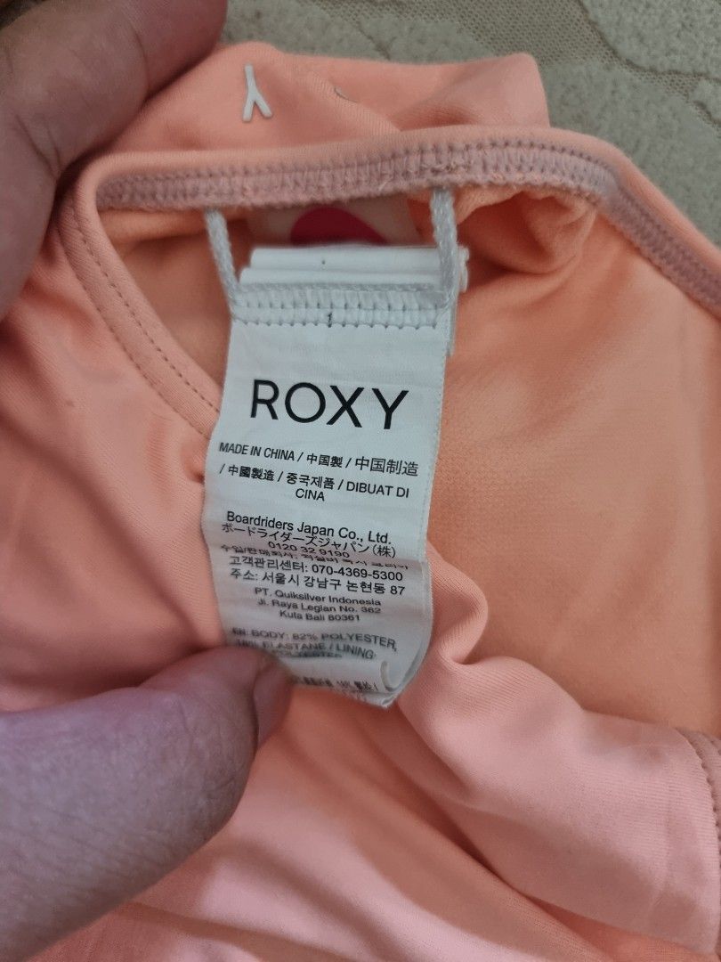 Roxy One-Piece Swimsuit Coral Size 10 (Category: Babies & Kids Fashion) located in Santa Rosa. Submitted by grace116 (Listing ID 1441412888, Image 2). Description: - Roxy one-piece swimsuit in coral pink - Features Roxy logo on the front - 'Since 1990' detail on the back - Cross-back straps for a secure and comfortable fit - Made in China - Ideal for swimming, beach days, or any water activity.