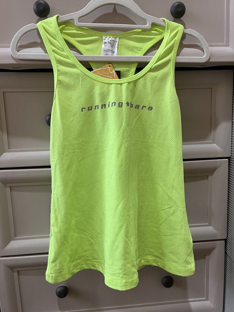 (RUNNING BARE) Neon Yellow Action Back Tank Top (Category: Activewear) located in Angono. Submitted by elyenitty_ (Listing ID 1441500263, Image 1). Description: - Neon yellow running tank top from Running Bare - Made in Australia - Breathable mesh fabric - Racerback design for freedom of movement - 'Running Bare' logo printed on the front - Lightweight and comfortable - Ideal for workouts or casual wear.