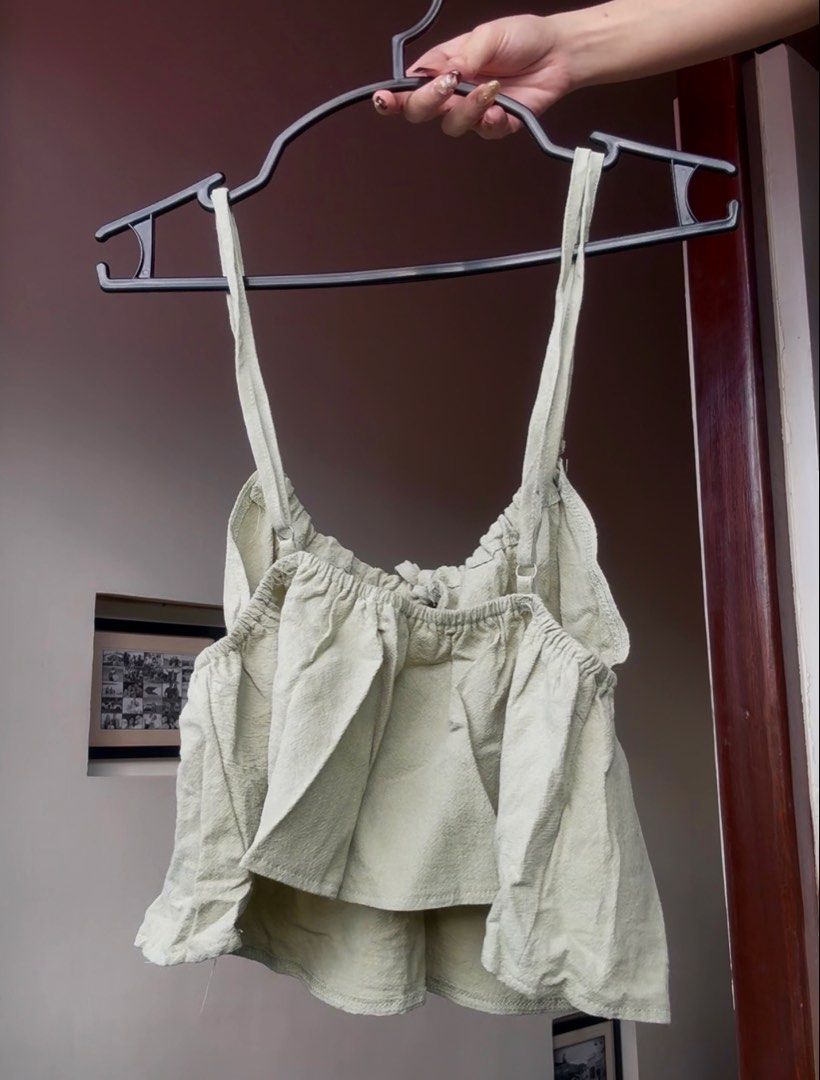 Sage Green Smocked Tie Front Crop Top (Category: Sleeveless) located in Sampaloc. Submitted by prelovedby.her_ (Listing ID 1441472052, Image 2). Description: Color: Sage Green Size: Fits XS-M Condition: No visible flaws; in great condition RFS: Decluttering 🧹 📍 Shipping from: Fairview, QC 🚚 Mode of Delivery: Lalamove | J&T 💵 Payment: GCash | Bank Transfer Feel free to message for any questions! 🤍.