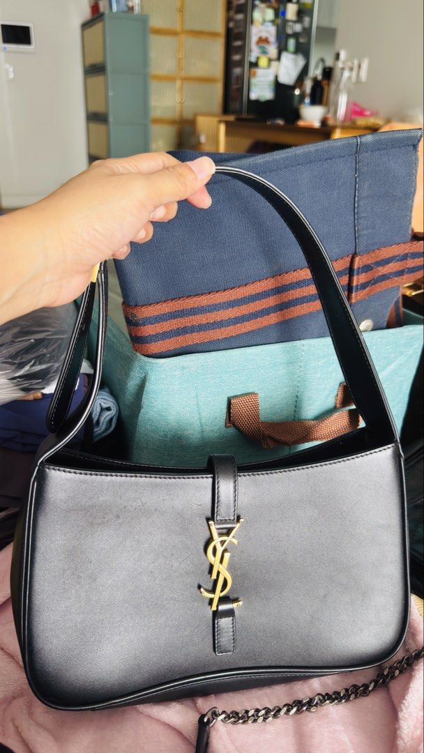 Saint Laurent Black Leather Shoulder Bag (Category: Luxury Bags & Wallets) located in Pasig City. Submitted by cecilececile4361 (Listing ID 1441438079, Image 2). Description: Black leather shoulder bag from Saint Laurent. Gold hardware details. Interior has a zip pocket and a leather tag. Clean inside. Strap is adjustable. Great everyday bag. Saint Laurent Le 5 à 7 Style Black Leather Shoulder Bag Bought in japan Inclusion: bag only.