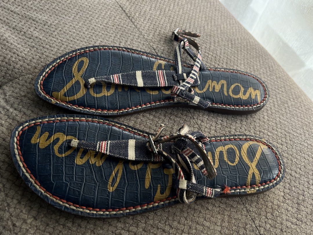 Sam Edelman Navy Striped Thong Sandals Size 9 (Category: Flats & Sandals) located in Makati City. Submitted by esila.essentials (Listing ID 1441574797, Image 1). Description: - Navy blue Sam Edelman sandals - Size 9 - T-strap design with red, white, and blue striped accents - Textured crocodile print footbed - Sam Edelman logo on soles - Ideal for casual wear.