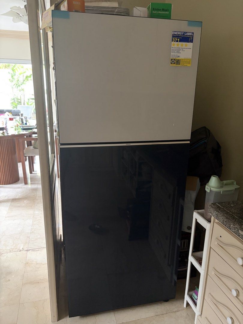 Samsung Bespoke Two Door Refrigerator (Category: Refrigerators and Freezers) located in Angeles City. Submitted by tinfrances (Listing ID 1441439479, Image 1). Description: - Samsung Bespoke Two-Door Refrigerator - Capacity: 13.9 cu.ft. - Model: RT38CB662228ATC - Energy Consumption: 377 kWh/annum - Design: Sleek white and dark blue finish - Features: Top freezer compartment - Benefit: Keeps food fresh and organized Almost new! Used 11 months only
