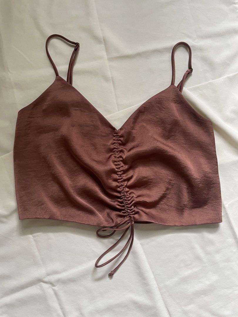 Satin Ruched Cami Top with Adjustable Straps (Category: Sleeveless) located in Quezon City. Submitted by declutter._.closet (Listing ID 1441420367, Image 1). Description: - Satin-silk material - Lovely muted rose color - Features ruched front with drawstring detail - Adjustable spaghetti straps for a perfect fit - Versatile: dress up or down, pairs well with jeans or skirts.