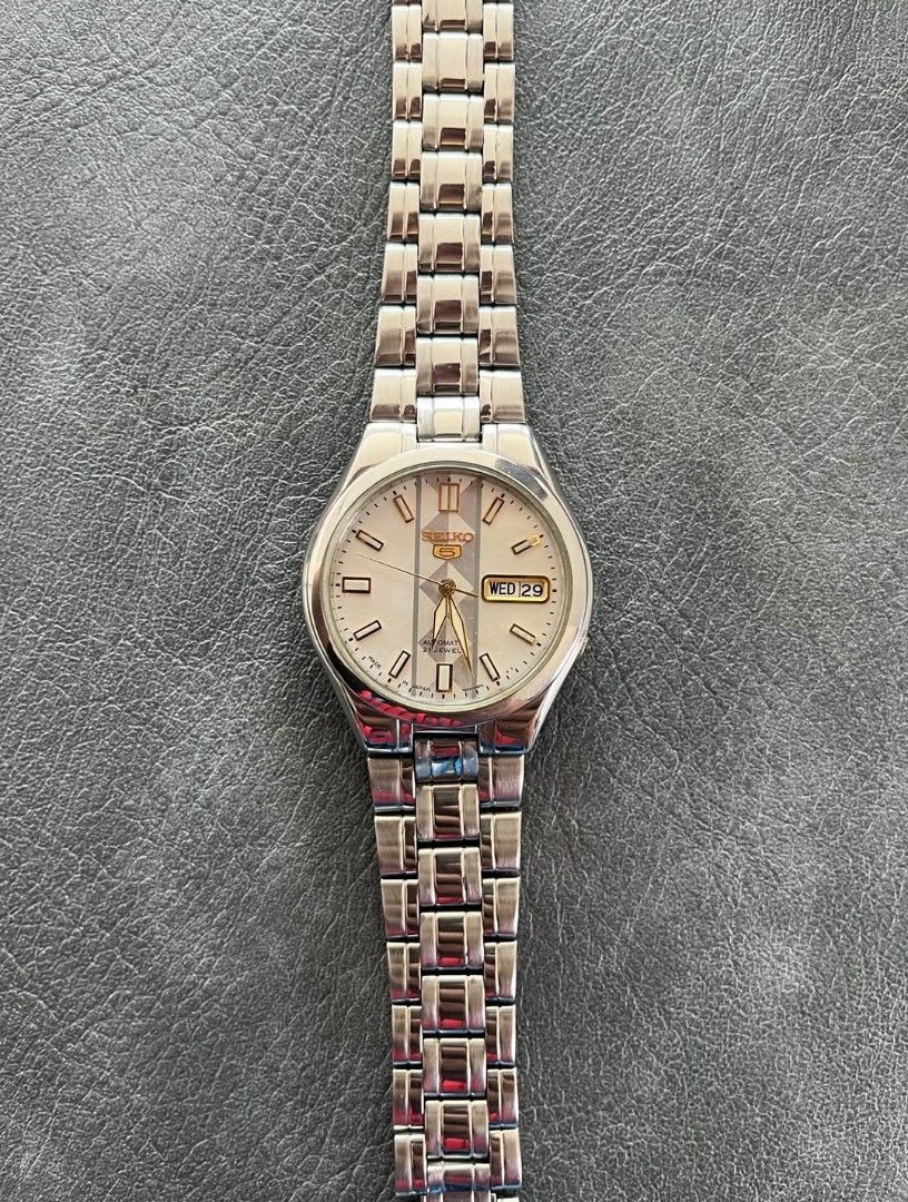 Seiko 5 Automatic Watch - Silver Stainless Steel (Category: Men's Watches) located in Manila. Submitted by reggiebatiancila (Listing ID 1441548008, Image 1). Description: - Seiko 5 Automatic Watch - Silver Stainless Steel Band and Case - Cream Dial with Gold Accents - Day and Date Window at 3 o'clock - Runs well - Great everyday watch -with seiko box PWEDE TAWARAN WAG NIYO LANG AKO MASYADO BARATIN .